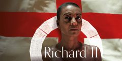 A black woman stands in front of an England flag.
