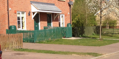 A photograph of waterbutts outside a house in Cambridge. Phone credits. E. Lawson.