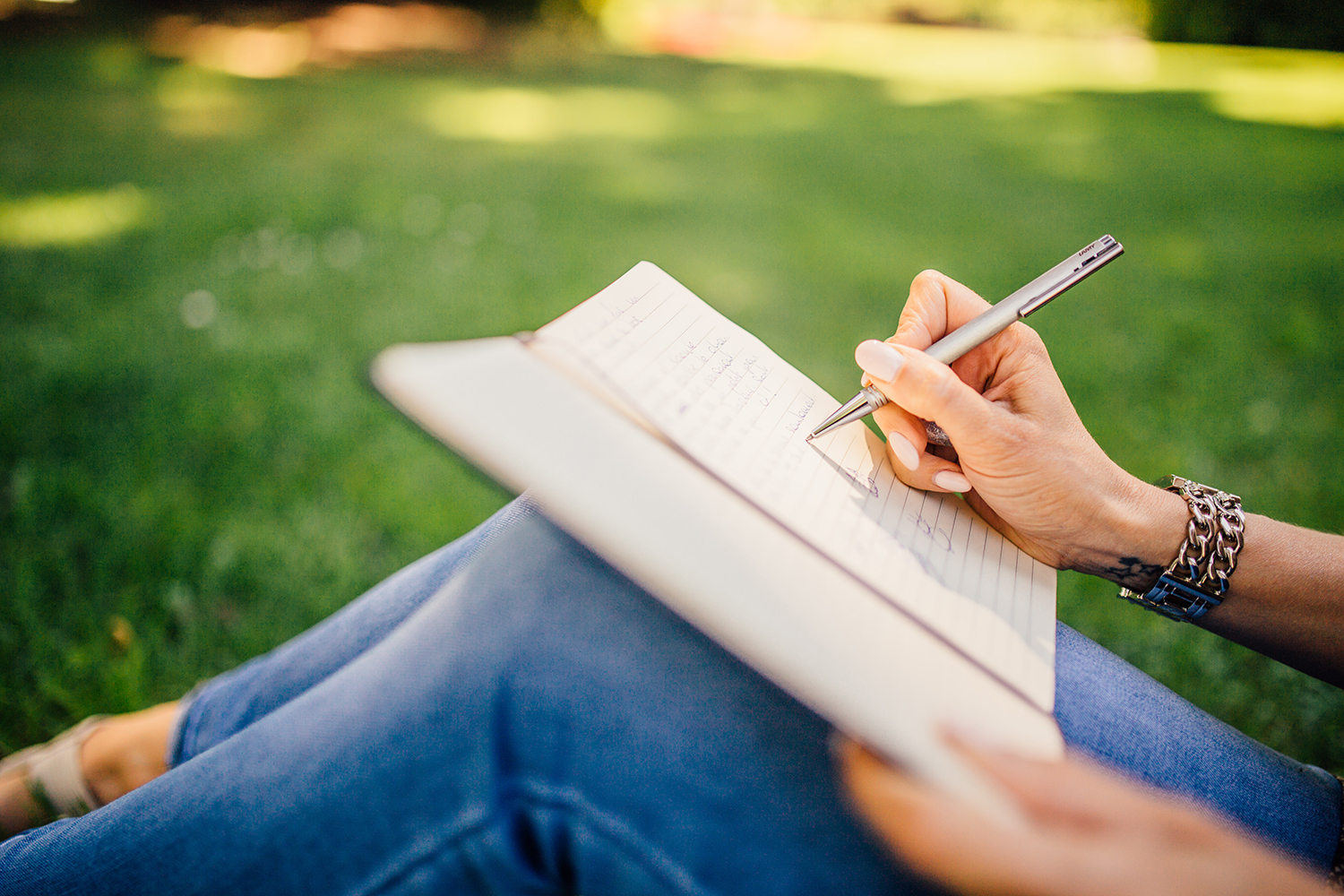 Student writing on white paper