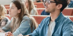Students in a lecture theatre listening to a talk