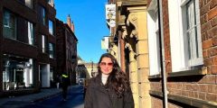 Image of Zainab stood outside her office