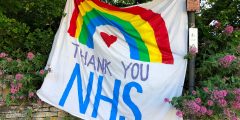 A piece of artwork that says 'Thank you NHS' with a rainbow over it.