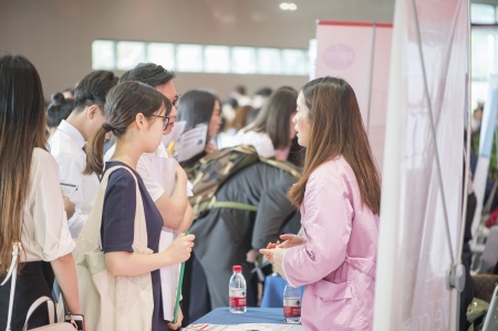 Students talking to employers at careers fair