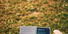Someone reading a book on digital marketing