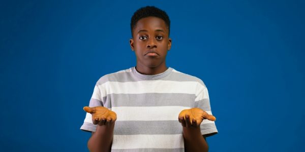Male looking unsure with his hands out in a gesture of uncertainty
