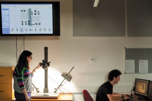 Volunteers demonstrate the plasma screen, copy stand and camera and workstation.