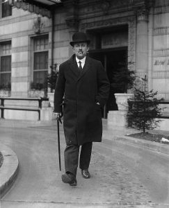 Photograph of Maurice Hankey strolling with his pipe, 1921