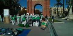 Local residents putting on protective suits surrounded by rubbish bags, preparing for a waste audit in a square in Barcelona
