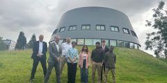 Vigence staff photo, standing outside a building on Jubilee Campus