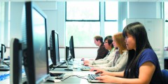 Undergraduate students working on computers in Pharmacy