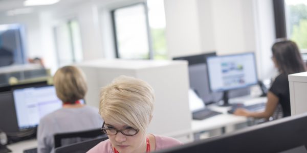 Female member of staff working in University Park Central Student Service Centre, Cherry Tree Lodge