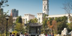 Undergraduate students relaxing in a garden opposite the Administration Building, Ningbo campus, China