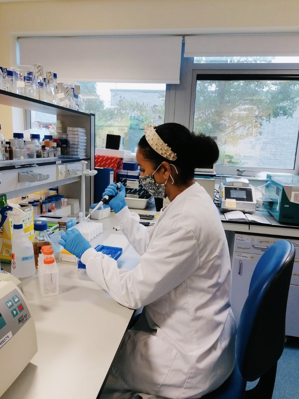 Toshana wearing a face covering in the lab
