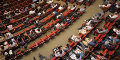 An auditorium filled with people.