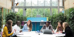 Undergraduate and postgraduate students studying in the Computer Science atrium, Jubilee campus