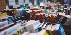 Books in boxes at a book sale.